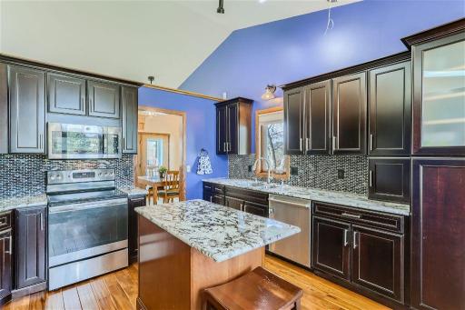 The large open kitchen has been recently remodeled and features new granite counters, tiled backsplash, and new cabinetry! You will love the countertop space and cabinet space! The high ceilings make it feel even bigger and brighter.