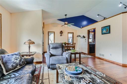 The living room is situated nicely in the middle of the home with easy access to the dining area and kitchen. The high ceilings make the space feel nice and open. The beautiful wood flooring is a highlight that extends throughout this floor.