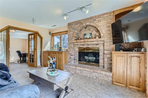 The family room features a wood burning fireplace, a great place to retreat in the colder months with your favorite book!