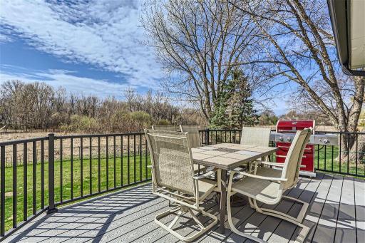 From the 3-season porch step out onto the maintenance-free deck where you can enjoy summer BBQs with friends overlooking a beautiful nature area.