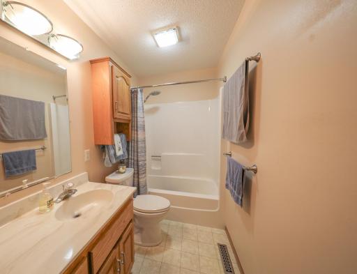 Three of the homes bathrooms are on the main floor. This full bath has great storage once again..jpg