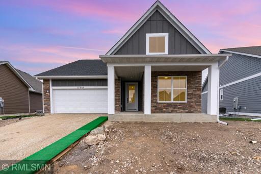 Front porch large enough for table and chairs. Landscaping ,sod, driveway all inclueded