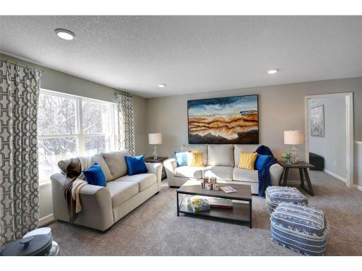 Relax, play, and enjoy! This upper level game room provides an additional gathering space and is conveniently located adjacent to all four of the upper level bedrooms. Photo of model home, color and options will vary.
