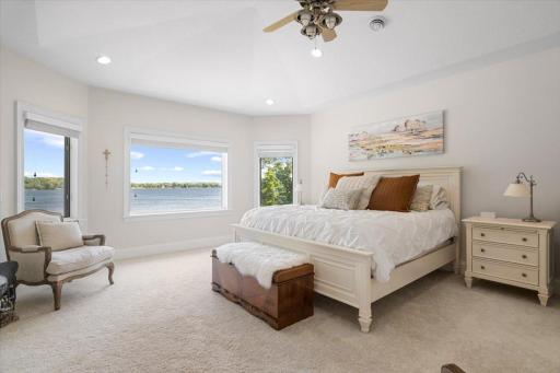 The primary bedroom has a private feel with your own unique lake view. Tall ceilings bring in all of the natural light.