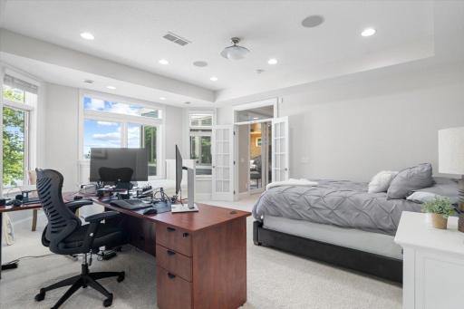This bonus room can be used as an office, lounge area, or an additional bedroom. Lake and patio views. Surround sound speakers provide quality sound while you work or relax.