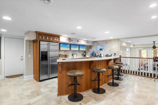 The lower level features a bar area that can seat 5 people comfortably. Space for 3 TV's to watch multiple channels at once.