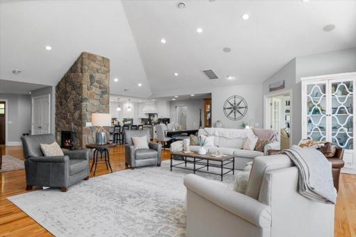 This space allows a continuous flow from living room to dining room to the chef's kitchen. Open the French doors to a great den space with a fireplace and more lake views.