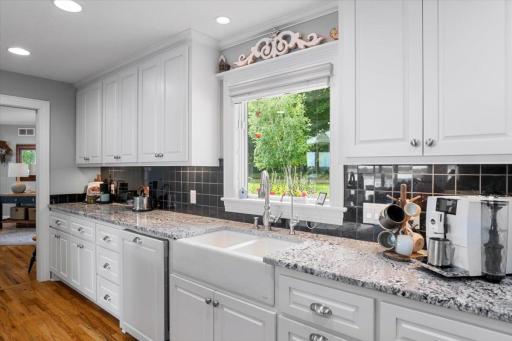 View the landscaping of the front yard through the kitchen window while you use the sink.