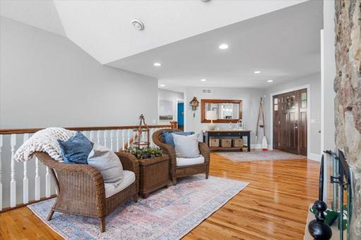 Sit and relax around the main level 2-sided fireplace.