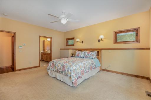 This primary bedroom suite offers: a private, 3/4 ensuite bathroom; and a spacious walk-in closet with custom organizer and built-in dresser.