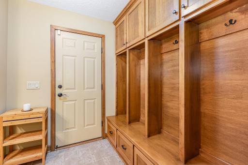 The lower level mudroom features: custom, built-in maple locker cabinets, ceramic tile floor, and access to the full bathroom from the back yard. This area helps avoid wet, sandy feet running through the home when a restroom is needed. :)