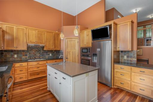The center island provides lots of storage, including a pull out cabinet for garbage & recycling. It also offers a great prep space, with it's 2nd sink.