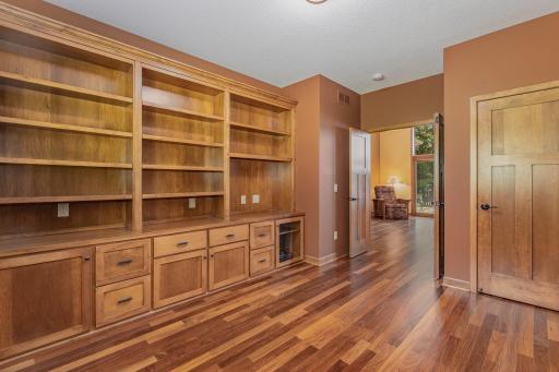 Another view of the 2nd bedroom/office shows: the closet (with a safe that's included); and 3 panel, solid core, double french doors.