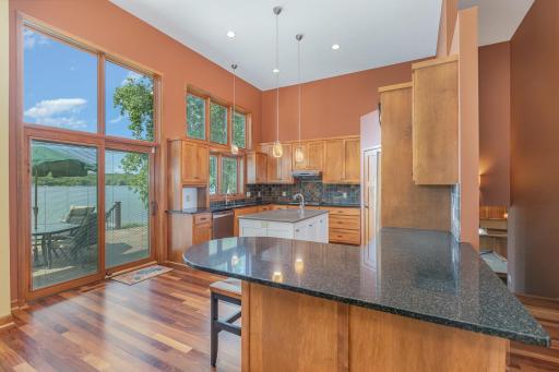 Enjoy entertaining in this gourmet eat-in kitchen. It has a breakfast bar with seating for 3-4 people (1 stool included), and offers convenient access to the paver patio. Included in the sale is a brand NEW (natural gas) Weber grill.