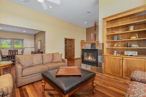 The living room also features: a gorgeous built-in bookcase, and 3 sided fireplace. The dining room in the background is open to the living room & kitchen - making this level a great space for entertaining family & guests.