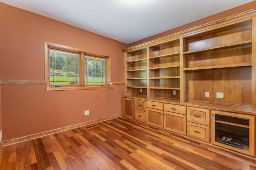 The 2nd bedroom/office features: a 9 foot knock down ceiling, a custom built-in bookcase, and Brazilian cherry hardwood floors.