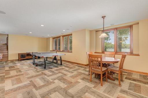 Another view of the family room. The pool table, ping pong table & card table are available for purchase. The entertainment center (behind the ping pong table) stays and includes: a Pioneer Elite receiver, Sony BlueRay DVD player, and a subwoofer.