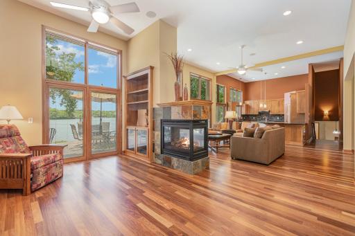 On the other side of the gas fireplace, is this inviting sitting room. Another built-in bookcase can house your flat screen TV. The Pioneer Elite receiver, Sony BlueRay DVD player, Yamaha 5 disc CD player & subwoofer are included with the home.