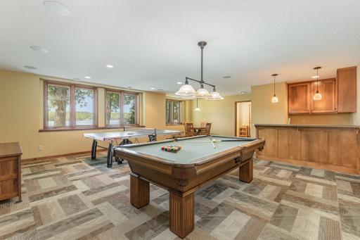 The lower level features: a family room, wet bar, 3rd bedroom, full bathroom w/separate sink vanity, and a custom storage locker area. It also includes: a large storage closet/mechanical room - which leads to a HUGE crawl space.