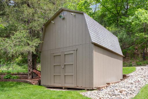 This 2 story shed stays w/the home & includes EVERYTHING inside it (except the push lawn mower). You'll find: tools, life jackets, water toys, etc. The shed is also outfitted w/4 security cameras. The monitoring equipment is in the home office.
