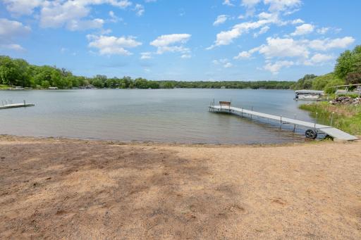 A close up view of the 150' sandy beach and private dock. Note how clear the water is - out to the end of the dock!