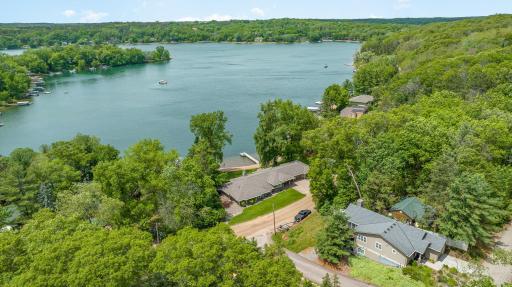 Another stunning, aerial view of this home, beach and dock.