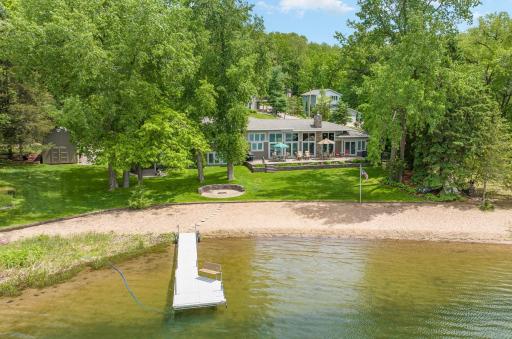 This amazing retreat offers 150' of sandy beach for endless fun with family & friends! Big Carnelian Lake is so clear ,and has a sandy bottom. This private dock & bench are just waiting for your boat!