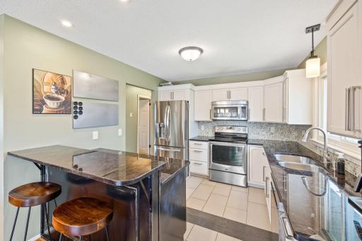 Enjoy chef inspired meals at the breakfast bar in this beautifully updated kitchen.