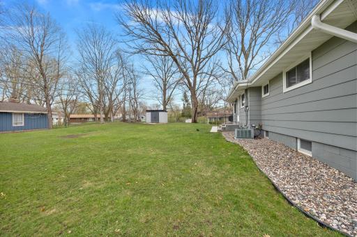 Beautiful flat yard space surrounded by mature trees. Property includes a new shed in 2020.