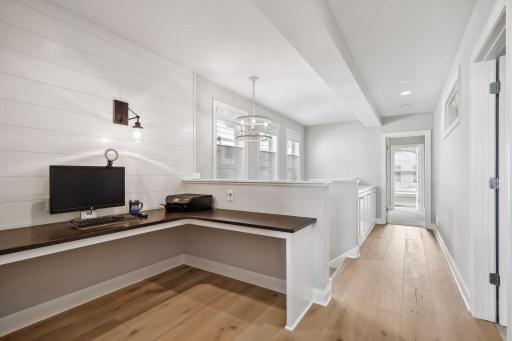 The upper level features a Pocket Office with an L-shaped built-in desk and shiplap feature wall.