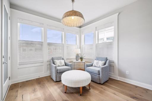 Just off the Kitchen is the Sun Room. Filled with natural light, enjoy sipping your morning coffee in this inviting space.