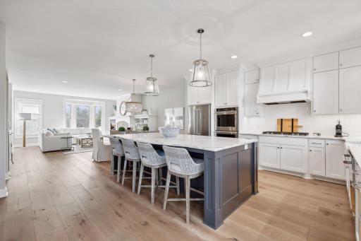 The well-appointed main level offers an open floor plan with gorgeous white oak floors and the highest level of fit and finishes.