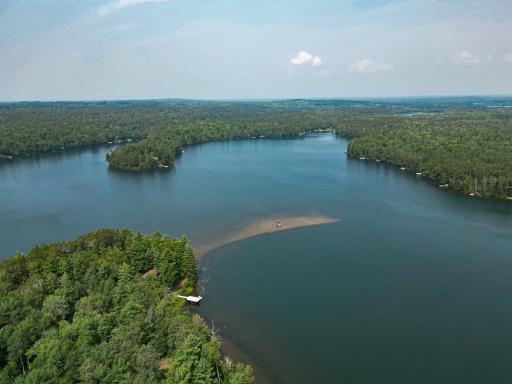 Beautiful Bass Lake features this large sand bar where you will find your fellow property owners hanging out on a hot summer day!