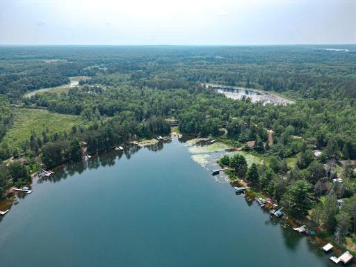 Bass Lake offers sneaky good fishing but we will keep that info under wraps. You can see 2727 Rapala Drive at the top of this photo, the sandy beach and large yard!