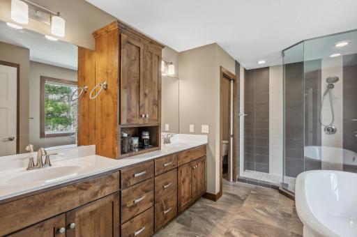 private spa-inspired ensuite with a soaking tub, separate shower, and enclosed water closet
