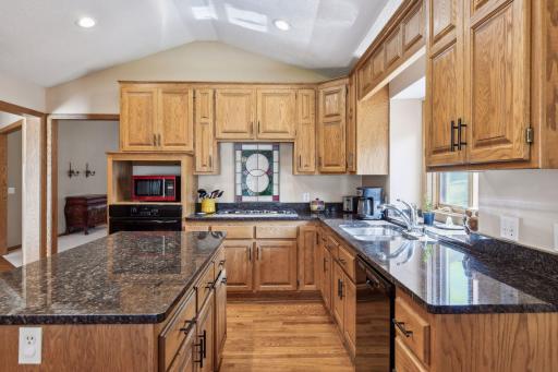 Vaulted ceiling, wood floors, granite countertops, undermount sink and great natural light!