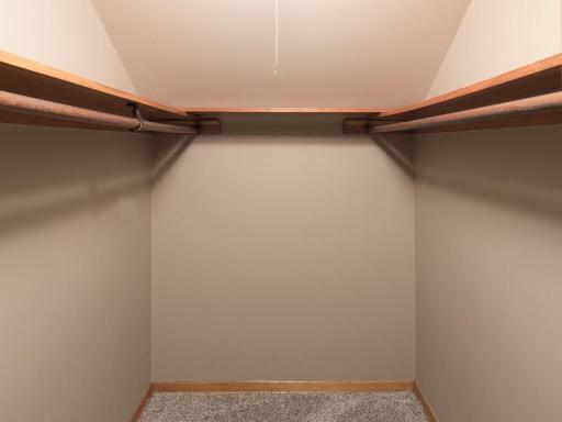 Walk-in closet and additional unfinished storage in attic crawl spaces.