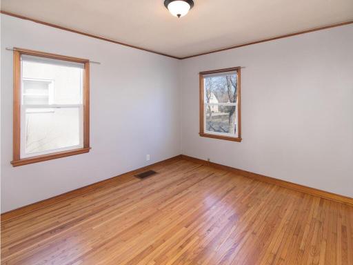 2 main floor bedrooms with hardwood floors and ample natural light.
