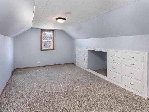 Large upper-level bedroom with tons of built-in storage.