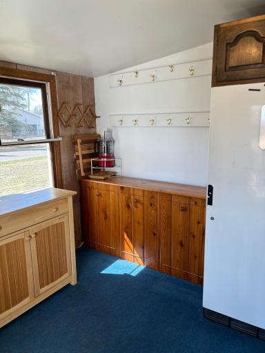 Entry porch view - great space for extra refrigerator/freezer and storage space!