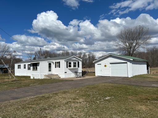 A 1992 year-round manufactured home plus detached insulated garage AND 24x32 pole shed for plenty of room for cars, boats and toys!