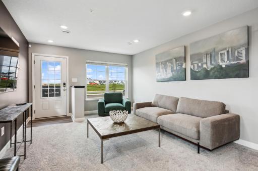 (Photo of decorated model, actual home's finishes vary) Feel at home in this spacious and open family room.