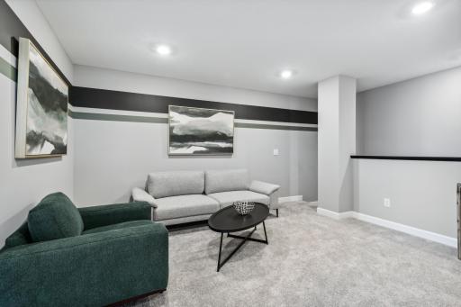 (Photo of decorated model, actual home's finishes vary) Located on the upper level, this perfectly sized living space has enough room for a desk, television and seating for all. Plus, it is just steps away from the three bedrooms.