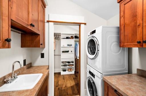 2nd Level: 2 Closets separated with a Laundry Room with stacked Washer/Dryer and Cabinets...