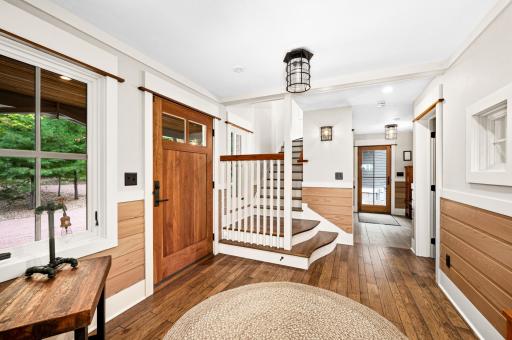 Main Level: Hand built by carpenter with turns and curves, 2 small windows on landing, empties to upstairs hallway with large bank of windows