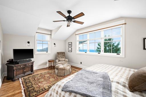2nd Level: Private Master Bedroom includes large windows with lake views...