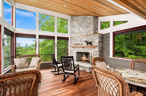 Main Level: 3 Season Screened Porch-includes a wood burning, masonry FP, GORGEOUS lake views, large upper windows allow room to be well lit...