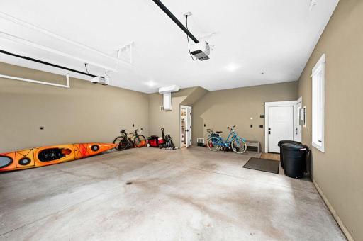 2-Car Garage is Heated and includes it's own Storage Room with Utilities to Garage and access to Carriage/Guest House