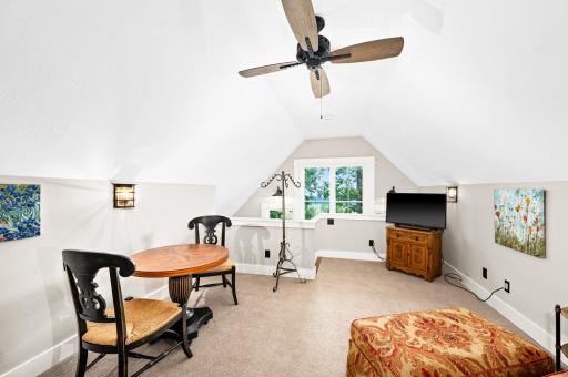 ...sitting area, wired for tv and internet, forced air heat and water heater, large windows capture lake view and built-in book cases