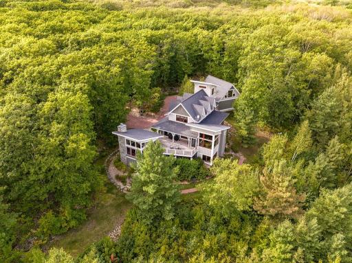 10-acre lot on private road, provides both a sense of being in the woods and dramatic lake views...